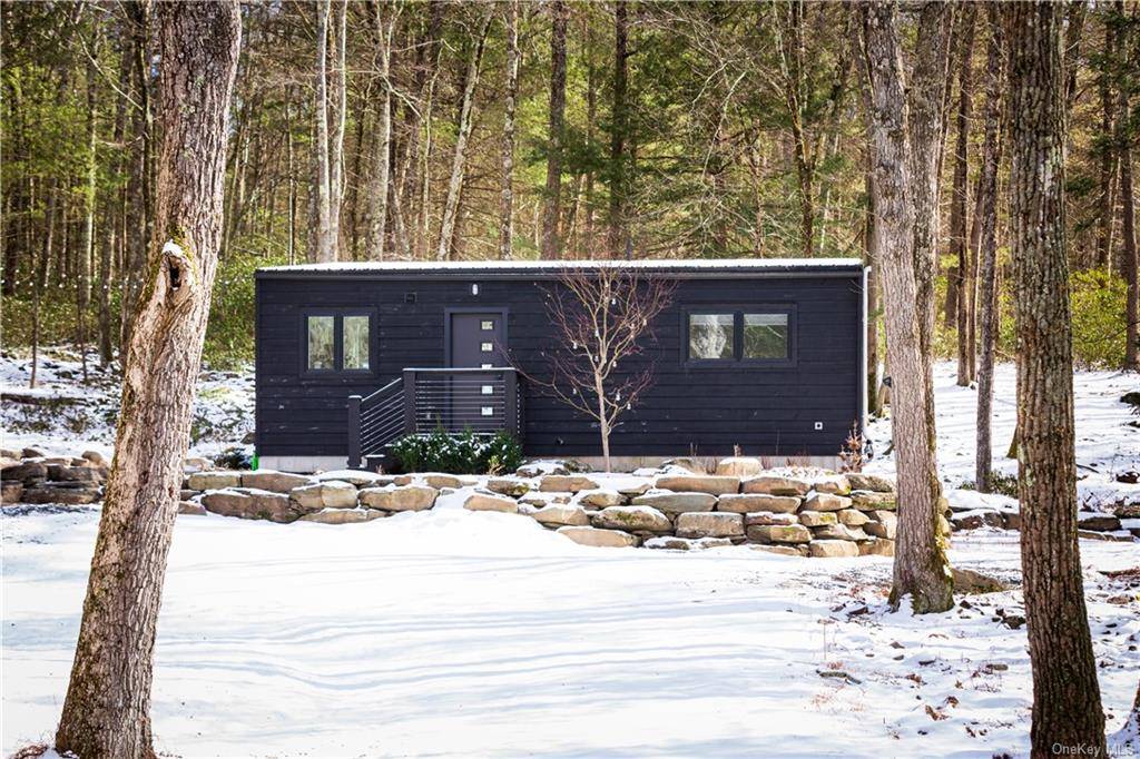 Nestled in the woods with seamless views of the surrounding forest, this design forward five year new home built by Catskills Farms, easily the most prolific builders in the Catskills ...