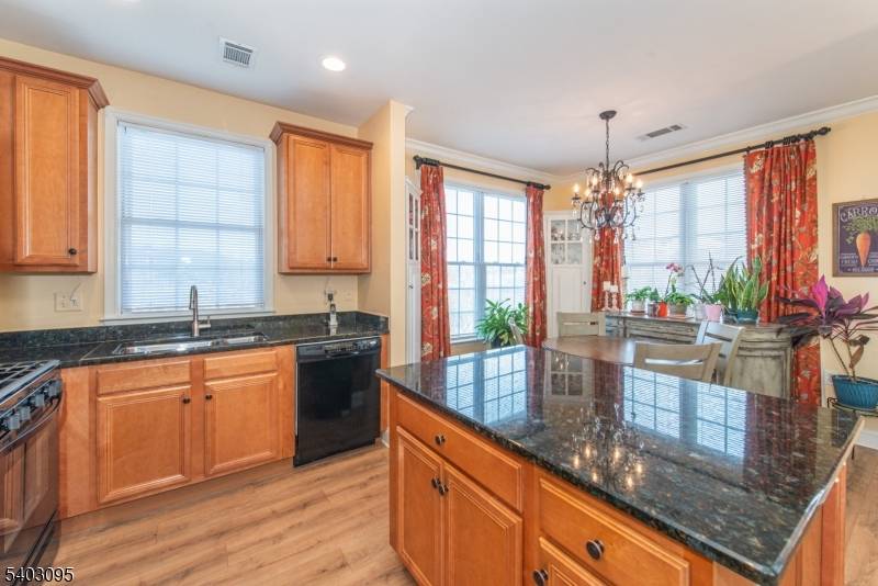 Spacious and sun filled 2 bedroom penthouse condo with a versatile loft, located on the 4th floor and offering beautiful sunset views.