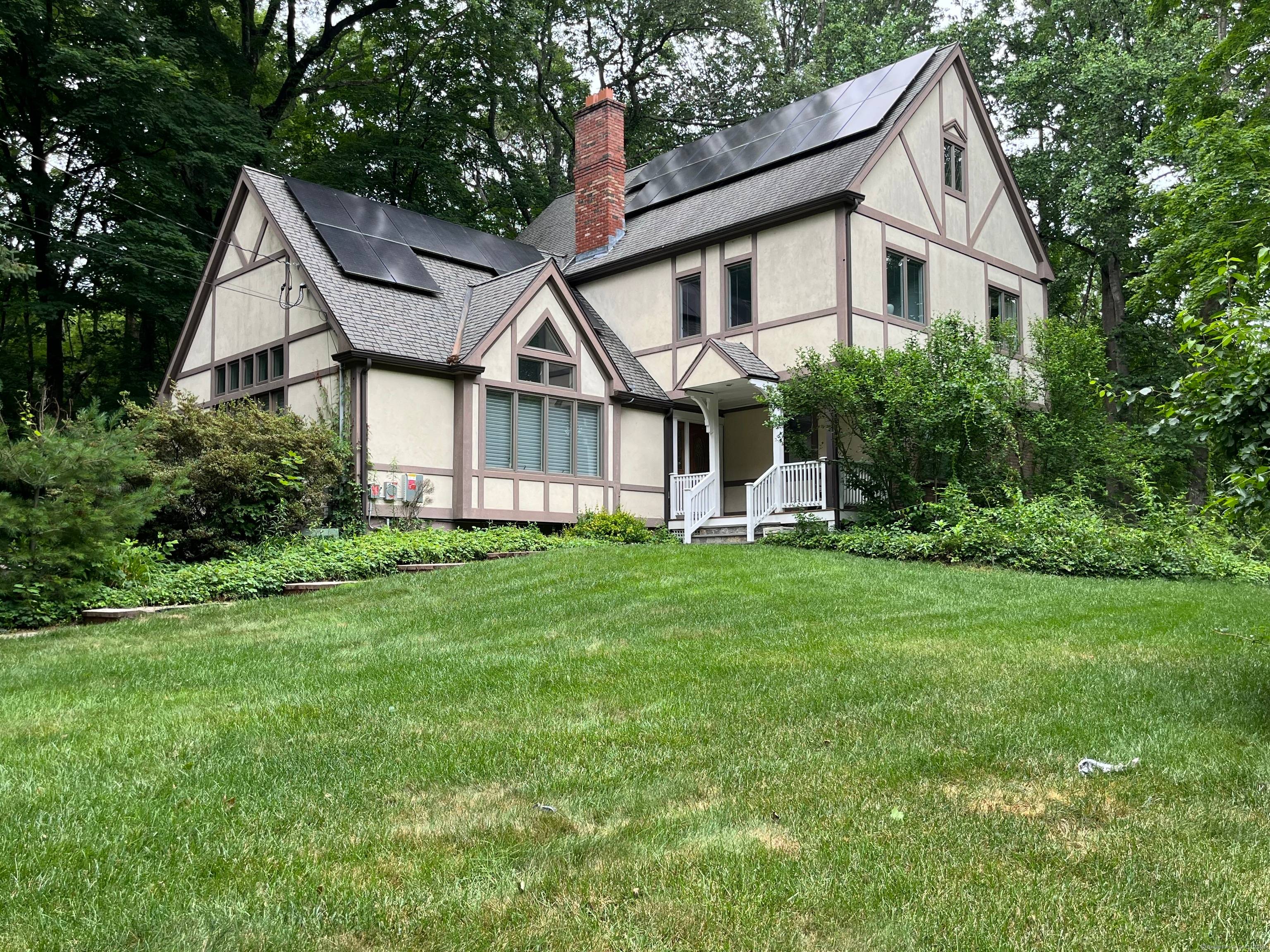 This stunning four bedroom Colonial with contemporary flair sits on 2.