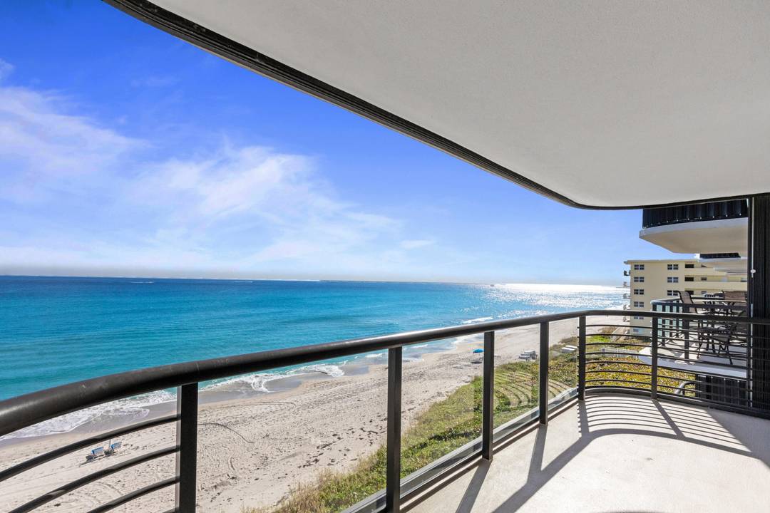 Spectacular Ocean Views and Lake Boca City Sunsets from this Beautifully Remodeled Marbella Residence.