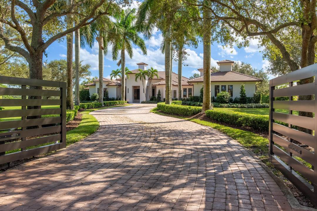 A rare opportunity to own one of the few 10 acre estates in Wellington's prestigious Palm Beach Point.