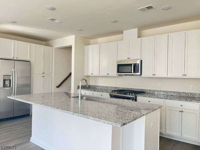 Just 12 min from Summit Train Station, this elegant brand new construction townhouse of the Hills at Warren is a must see.