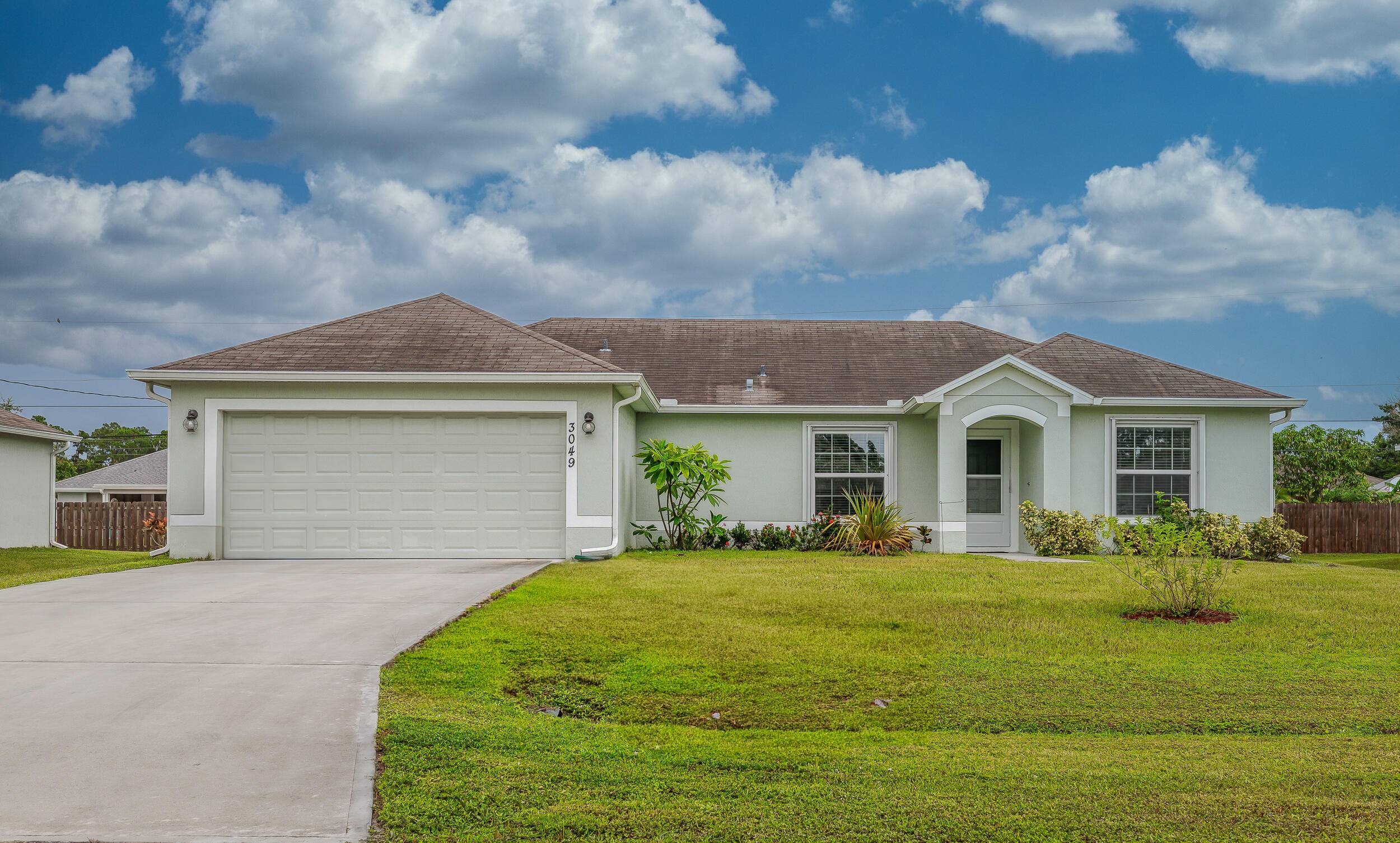 Welcome to this bright and beautifully maintained 3 bedroom, 2 bath home with a 2 car garage, built in 2019 and perfectly situated in the heart of Port St.