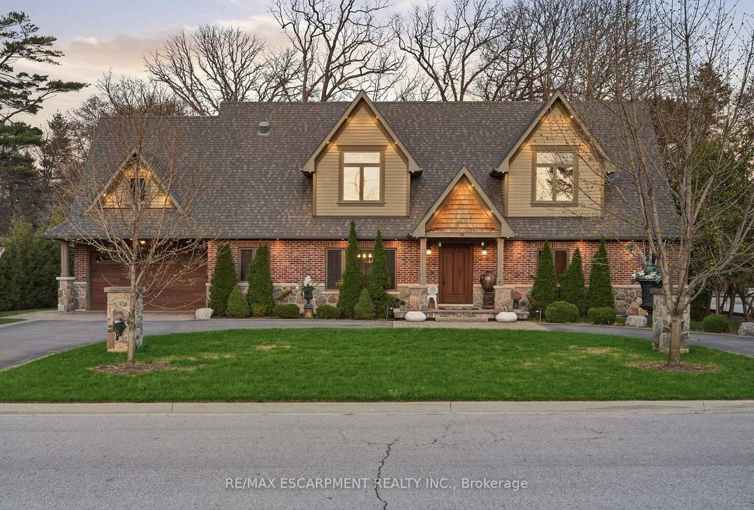 Timeless design and exceptional functionality define this beautifully finished home set on a landscaped lot with a circular driveway and strong curb appeal.