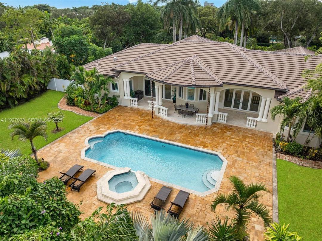Experience newly remodeled sophistication at 6890 SW 94th Street, Pinecrest, FL an exceptional one level estate featuring high ceilings throughout, set on 1 acre of mature, beautifully curated landscape.