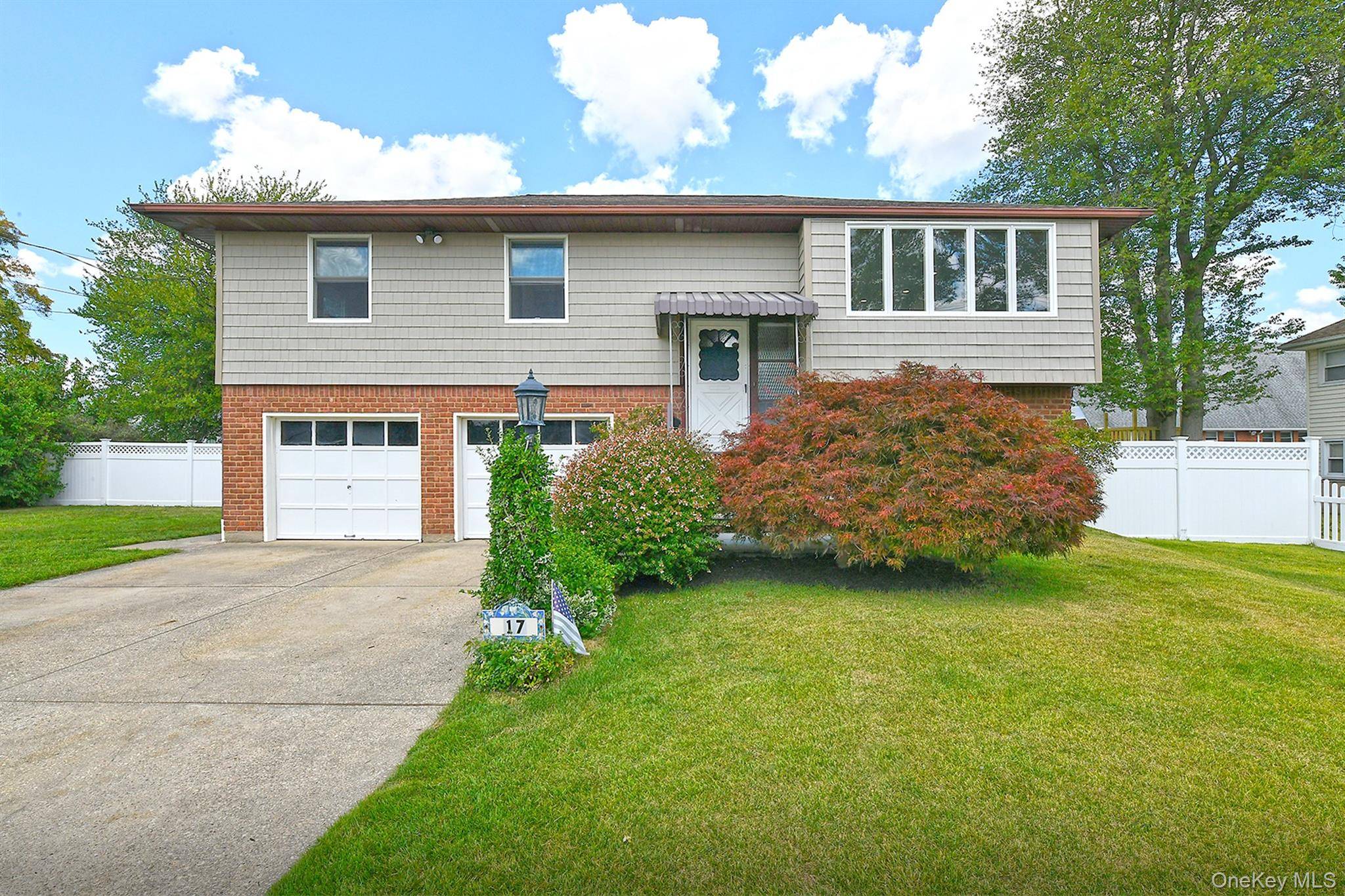 Welcome to this beautifully maintained, light and bright, updated Hi Ranch, ideally situated in one of the most sought after neighborhoods within the Hicksville School District.