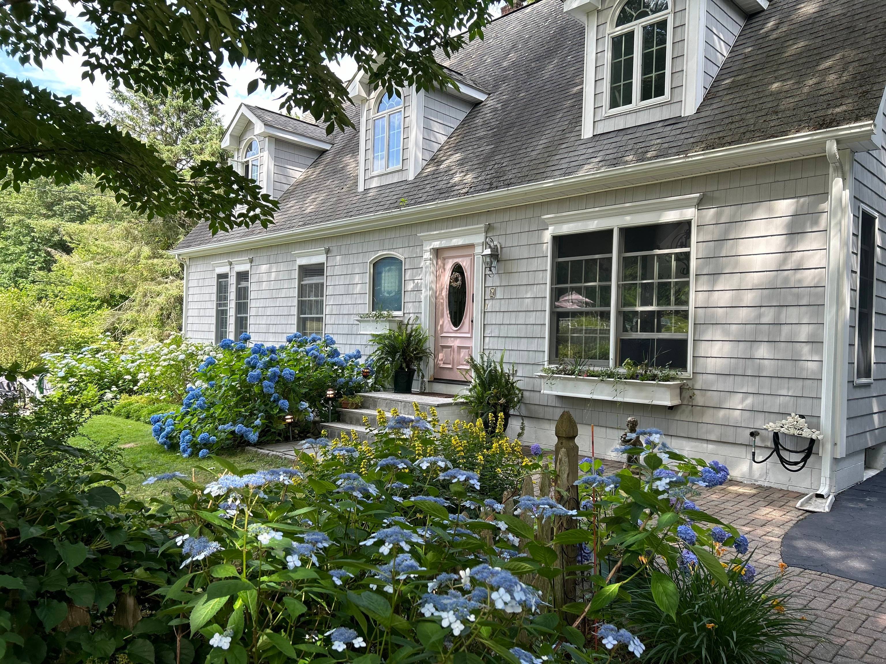 Whether you're seeking a peaceful oasis or an elegant home for entertaining, this Mystic Cape offers it all.