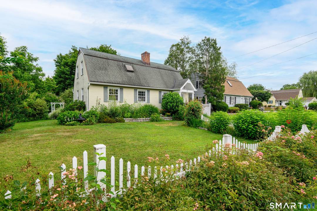 Tucked away this lovingly maintained colonial home feels warm and charming.