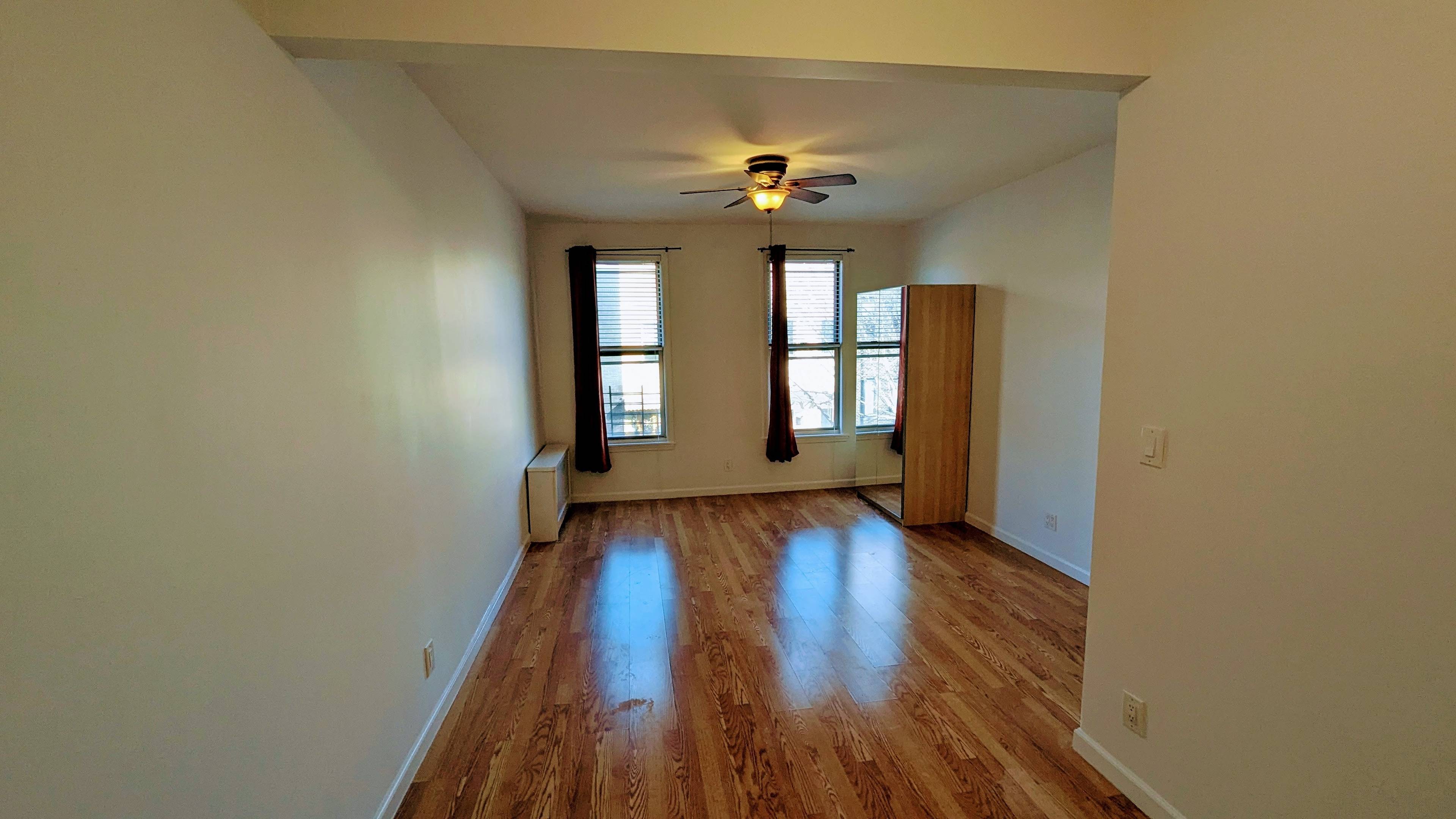 Bright two bedroom floor thru unit, one flight up.