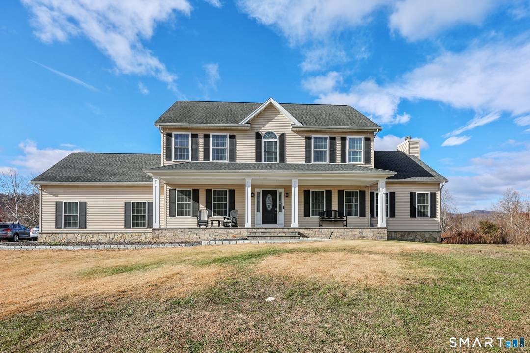 An expansive front porch sets the tone and provides the perfect spot for relaxing and enjoying the quiet surroundings of this cul de sac location.