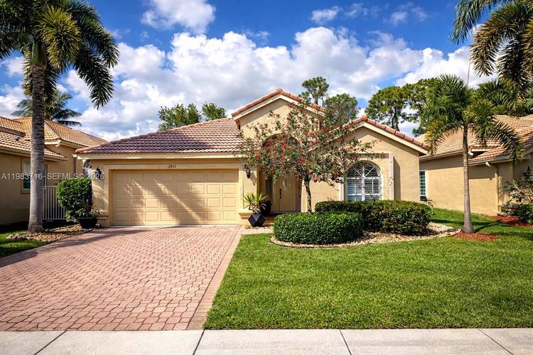 Welcome to this beautifully updated residence located in the desirable gated community of Palladium at Twin Lakes in the heart of Boynton Beach.