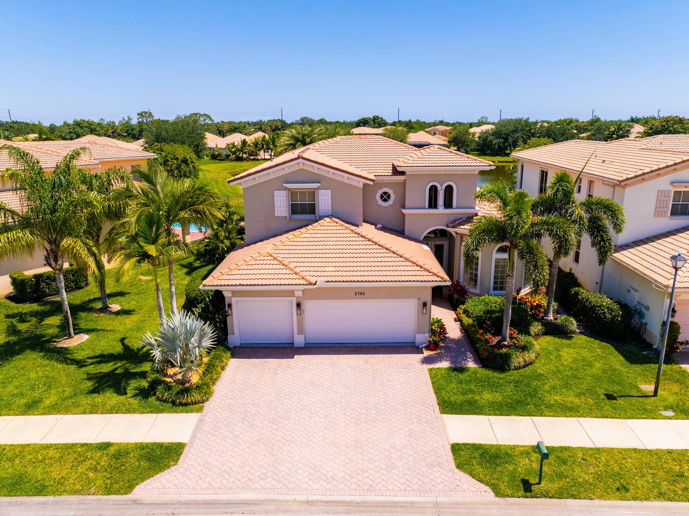 This stunning two story home in a gated community offers 4 bedrooms with the Master Bedroom downstairs, three baths, and a three car garage.