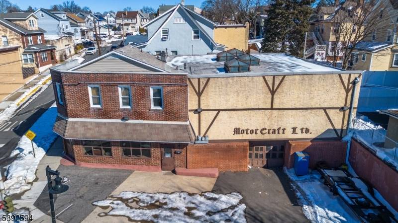 Located in the heart of bustling downtown East Rutherford, this versatile commercial property offers a rare opportunity for business owners, investors, and automotive enthusiasts alike.