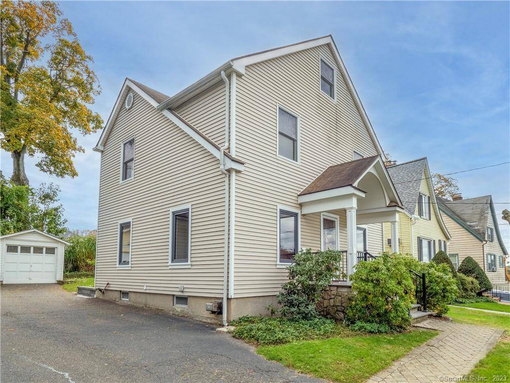 Step into this beautifully updated home featuring 9 foot ceilings on the first floor, new windows with privacy blinds and a modern kitchen with newer appliances and granite countertops.