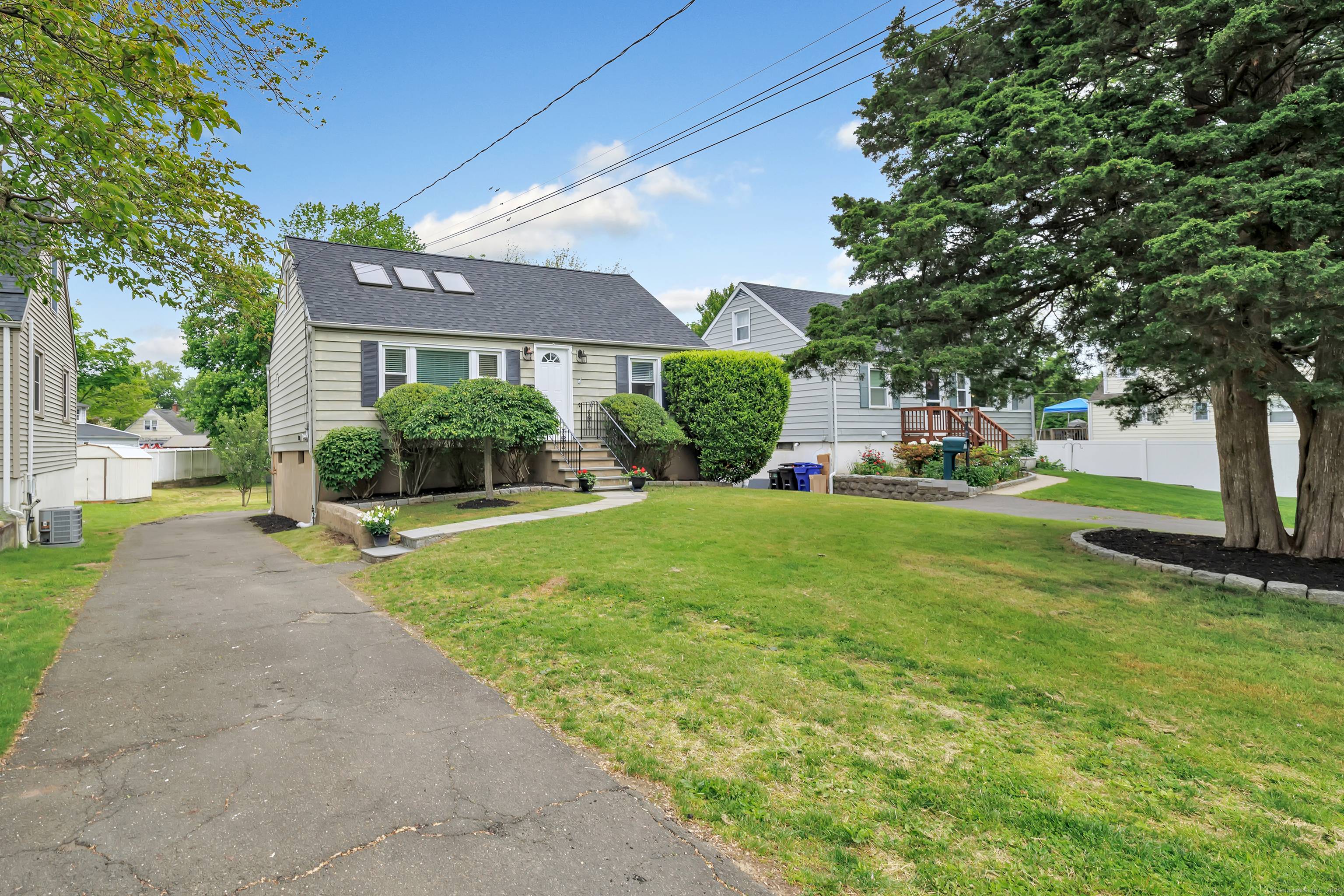 Welcome to this beautiful, updated cape in the heart of the desirable Wolfpit neighborhood.