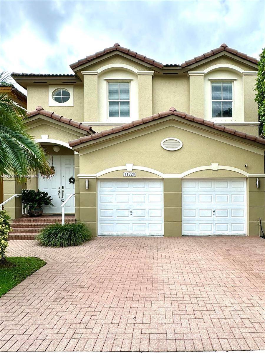 Located in the heart of Doral, this stunning corner house offers a perfect blend of comfort and style in a private, gated community.