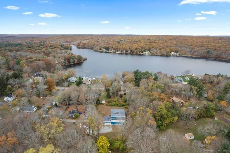 Welcome to this stunning, rarely available contemporary new construction at the end of a quiet cul de sac with partial views of Moodus Reservoir.