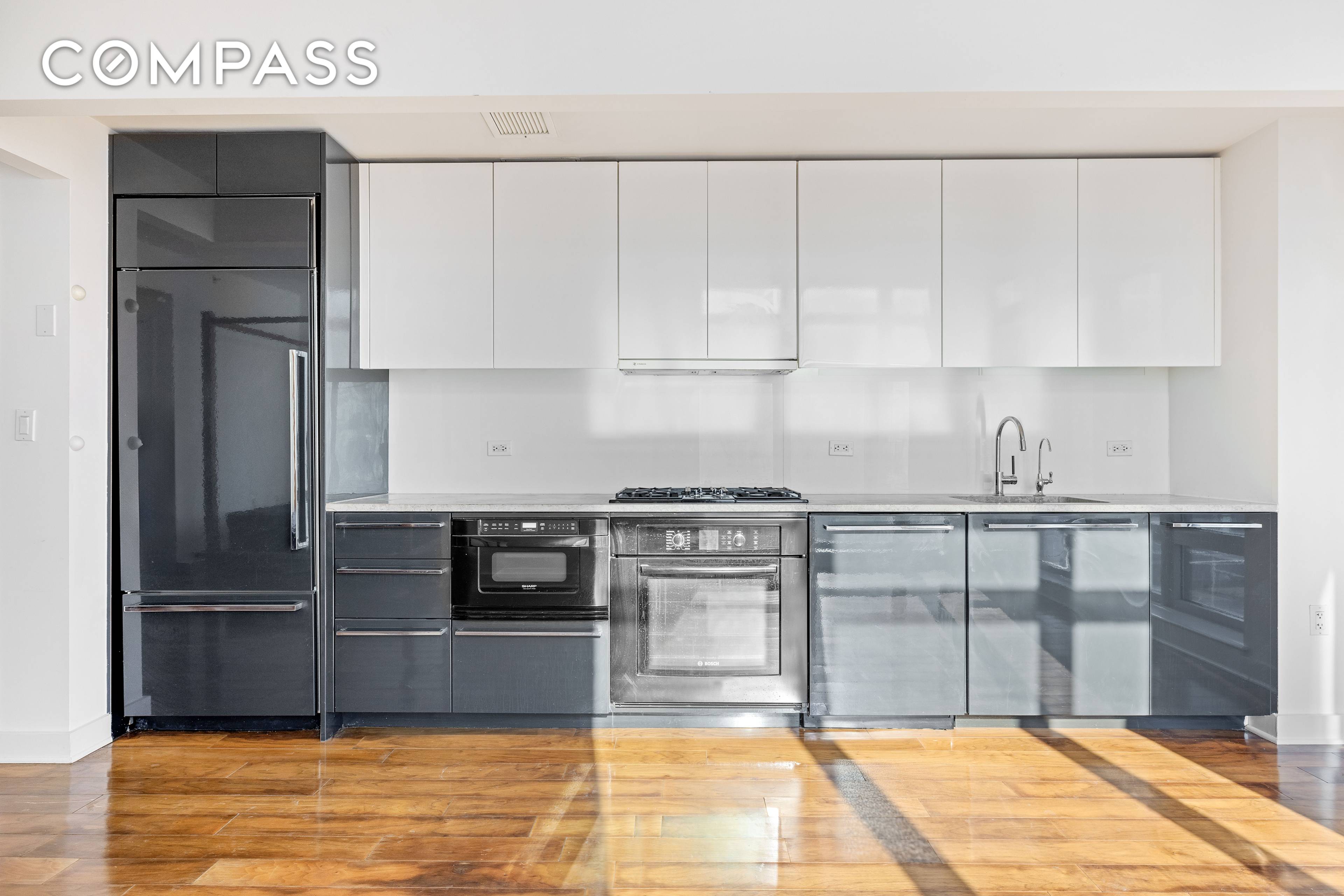 This spacious corner alcove studio boasts stunning open views and a sleek, modern design.