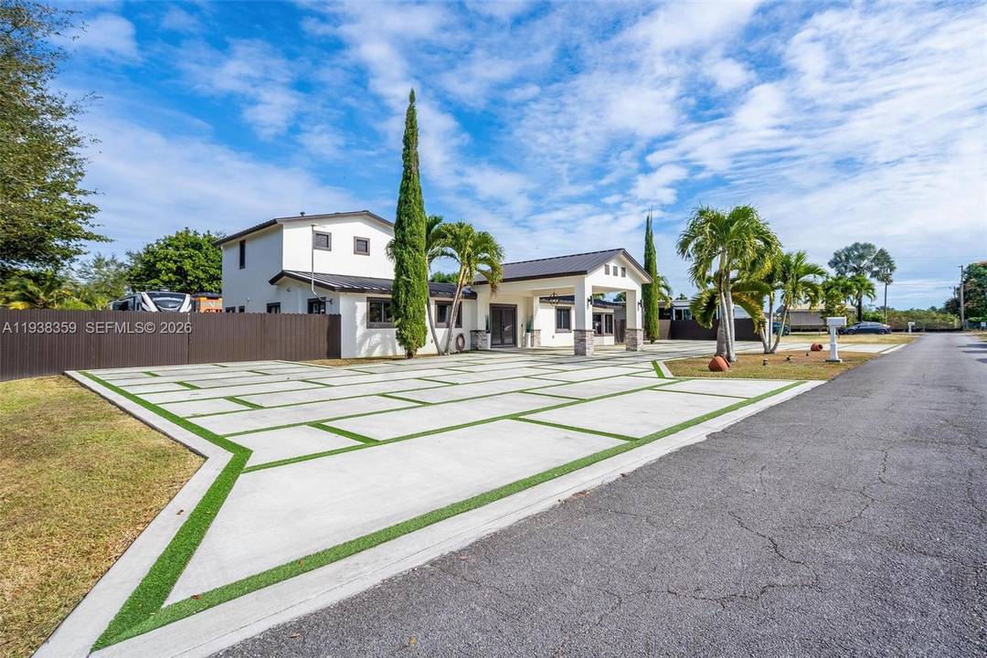 This fully reimagined 4 bedroom, 4 full bathroom, and 1 half bath estate is the result of a thoughtful, top to bottom renovation that blends modern architecture with resort inspired ...