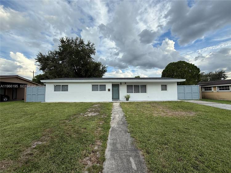 Updated Miami Gardens pool home set on a generously sized lot in a quiet residential neighborhood, offering a highly versatile layout that can function as a 4 bedroom 3 bathroom ...