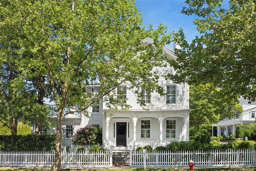 Nestled on Captains Row in Sag Harbor Village, this elegant historic residence has been meticulously restored.