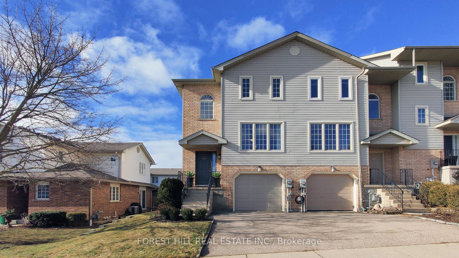 Welcome to this charming end unit townhome nestled on a premium oversized lot !