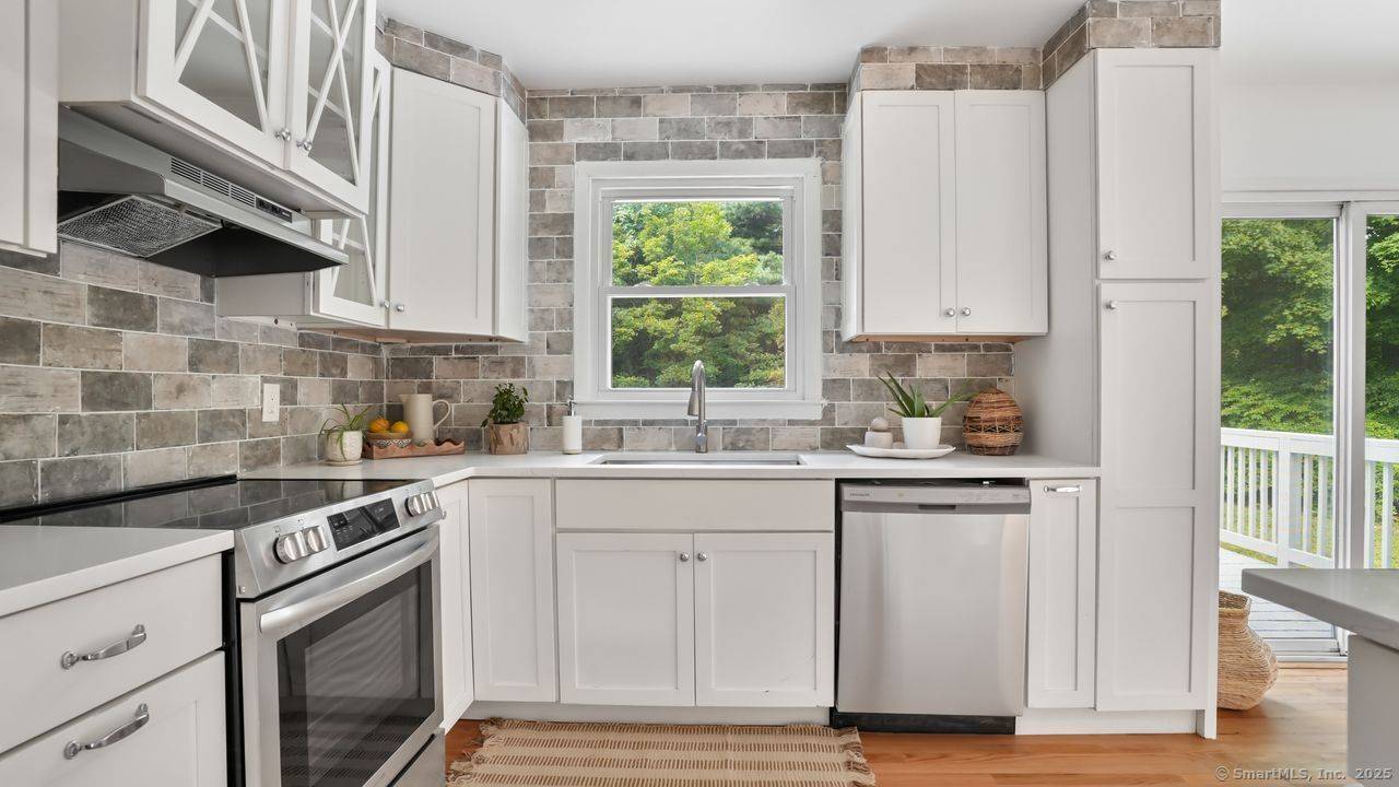 Step into this newly renovated Candlewood Lake home, where New England charm blends seamlessly with modern updates.