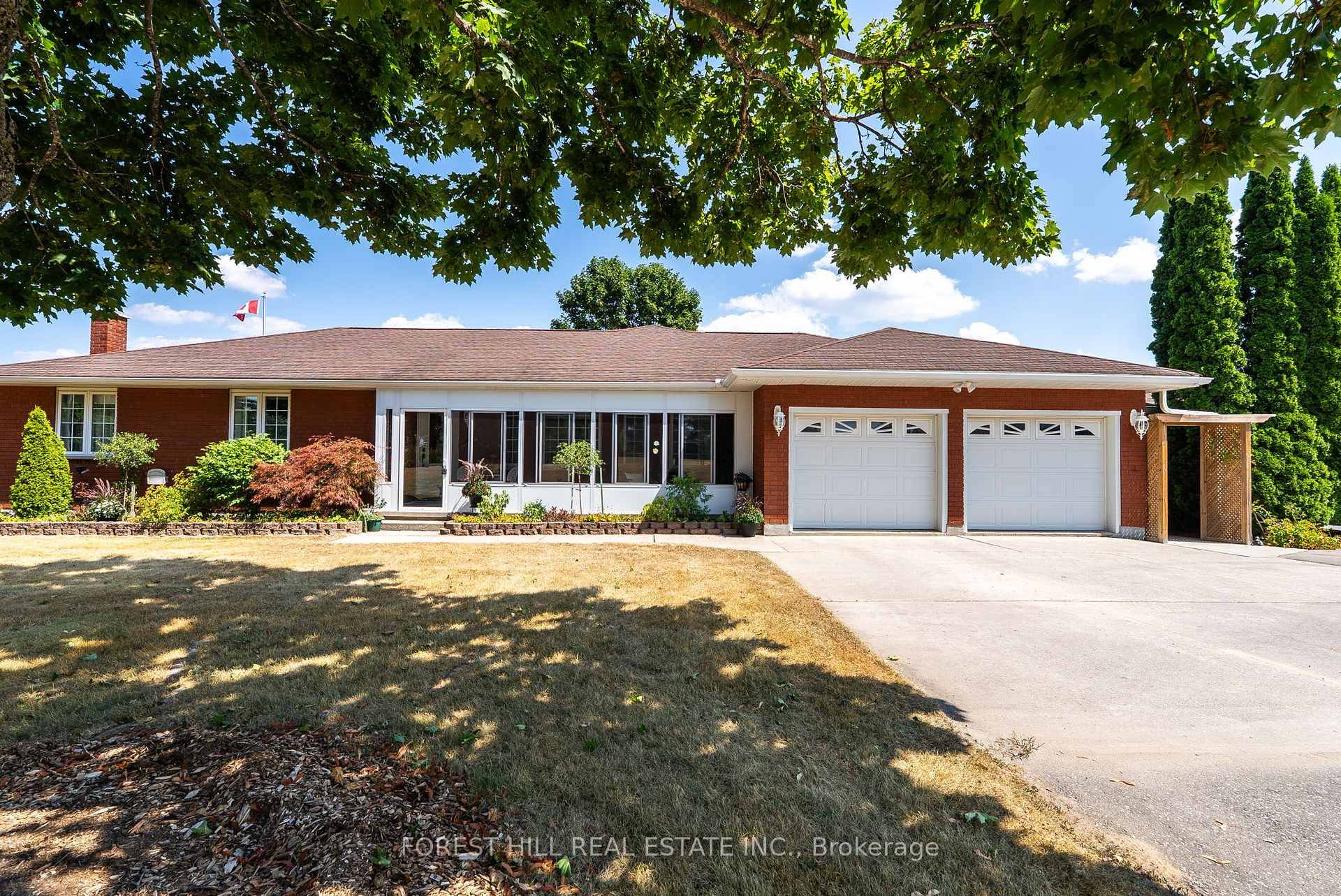 A Stunning Custom Built Brick Bungalow on 2 Acres with Private Lakeside Access !