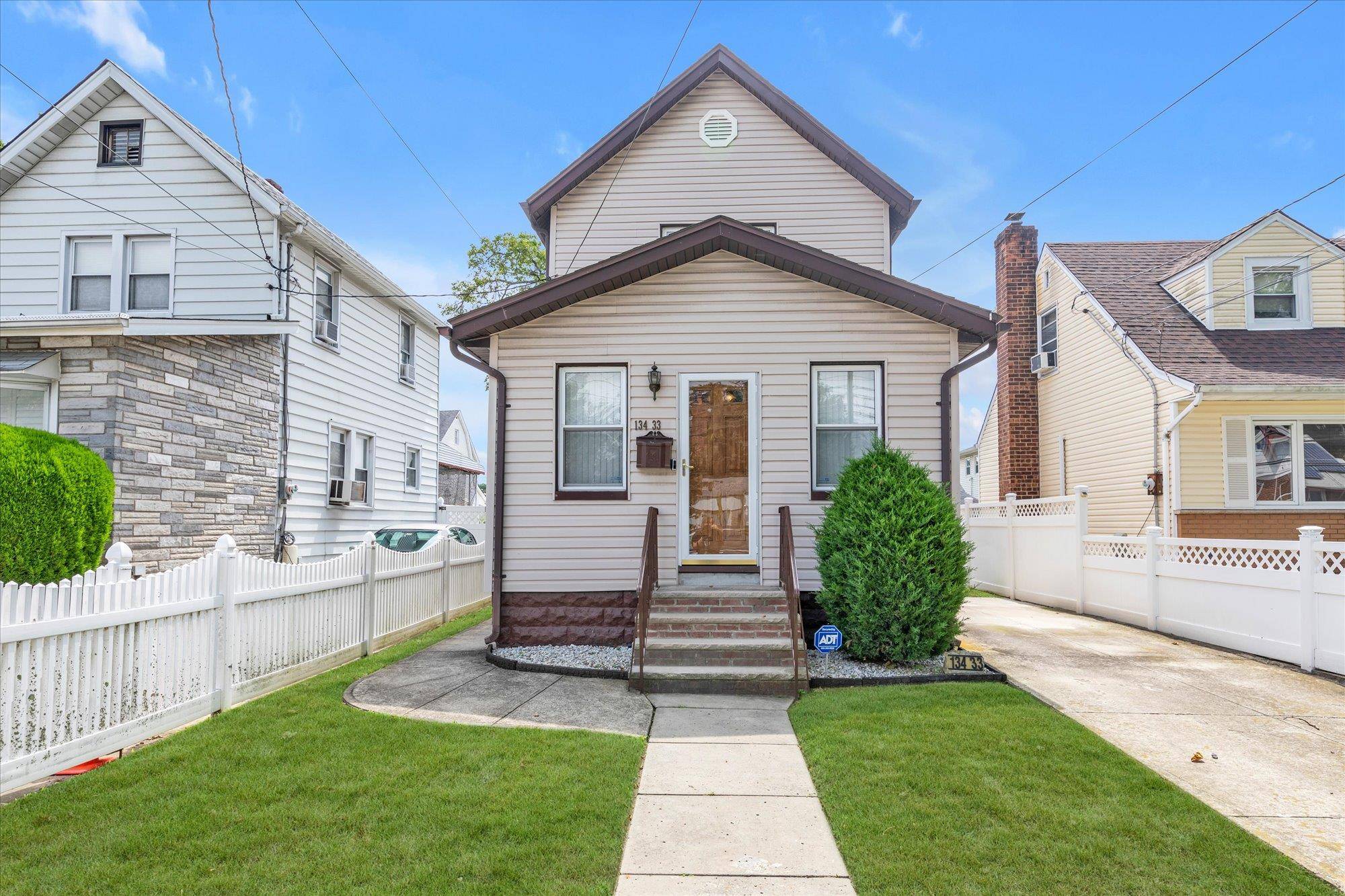 Impeccably Maintained Home on A Beautiful Residential Block.