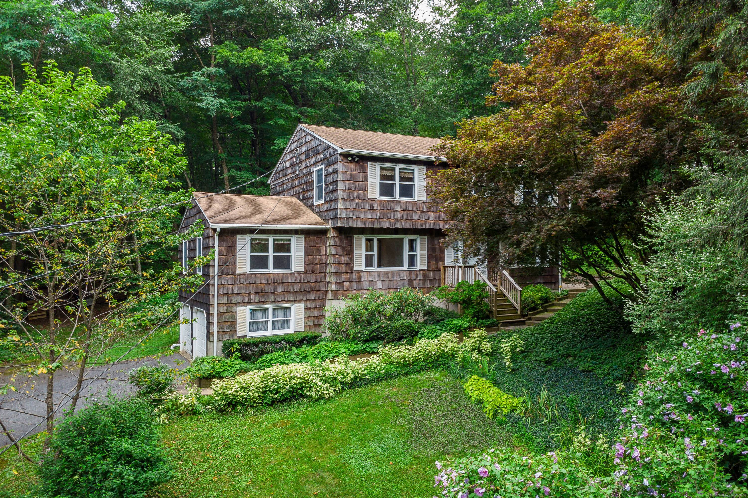 Welcome to 159 Route 37 in beautiful New Fairfield, CT a comfortable, private, and well maintained 4 bedroom, 2.