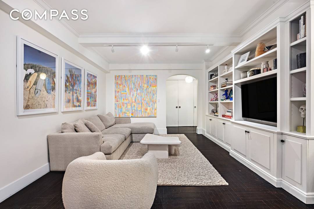 Move right into this warm and inviting, renovated corner two bedroom, two bath prewar residence that perfectly balances classic elegance with everyday comfort.