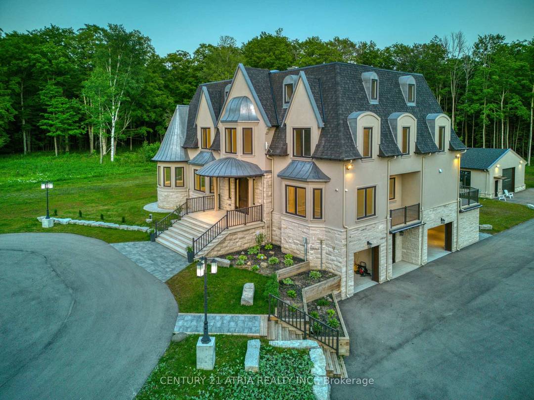 Privacy and nature lovers, this French inspired masterpiece is built on 24 acres of lush, forested land.