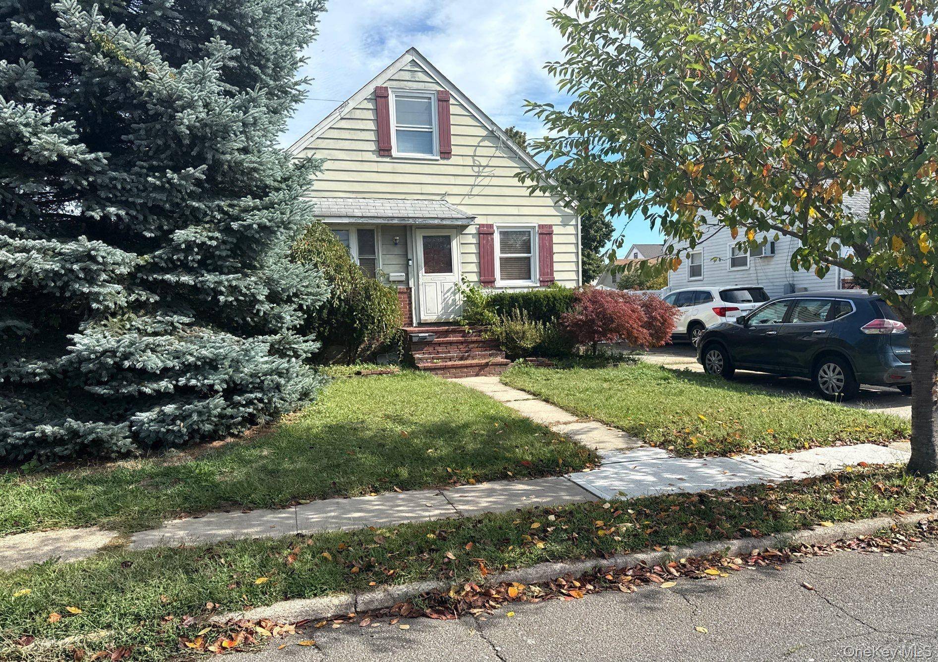 This Cape Style Home Features 4 Bedrooms, a Formal Dining Room, Eat In Kitchen, and a one car garage.