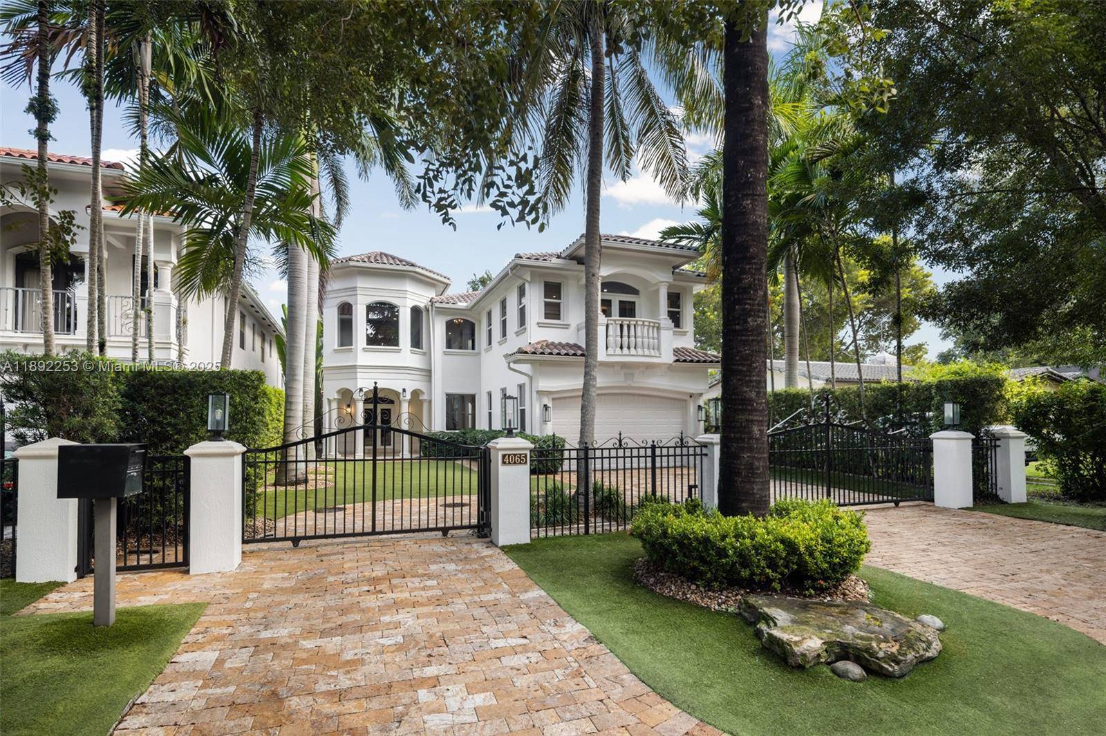 A gated Mediterranean inspired retreat in South Coconut Grove, this two story residence blends elegant design with seamless indoor outdoor living.