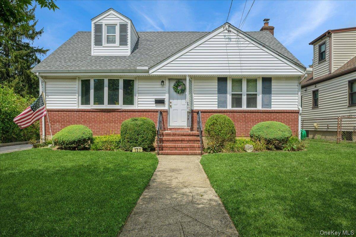 Nestled in the desirable New Hyde Park Garden City Park area, this lovely 4 bedroom, 2 bath wide line cape with a rear dormer offers abundant space and potential.
