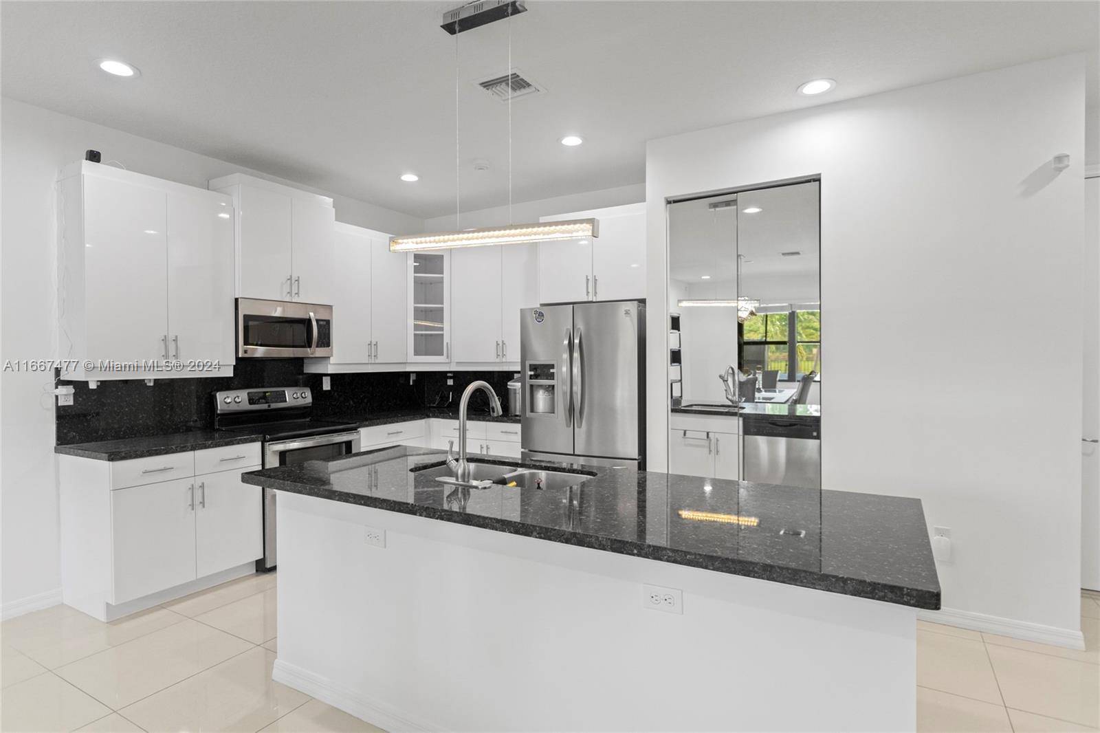 Spectacular 5 bedroom, 6 bathroom home with a stunning white kitchen and gorgeous hardwood floors.