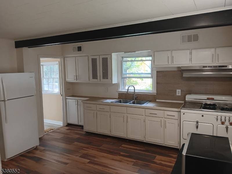 Charming Cape Cod in a highly desirable location directly across from Cedarbrook Park.