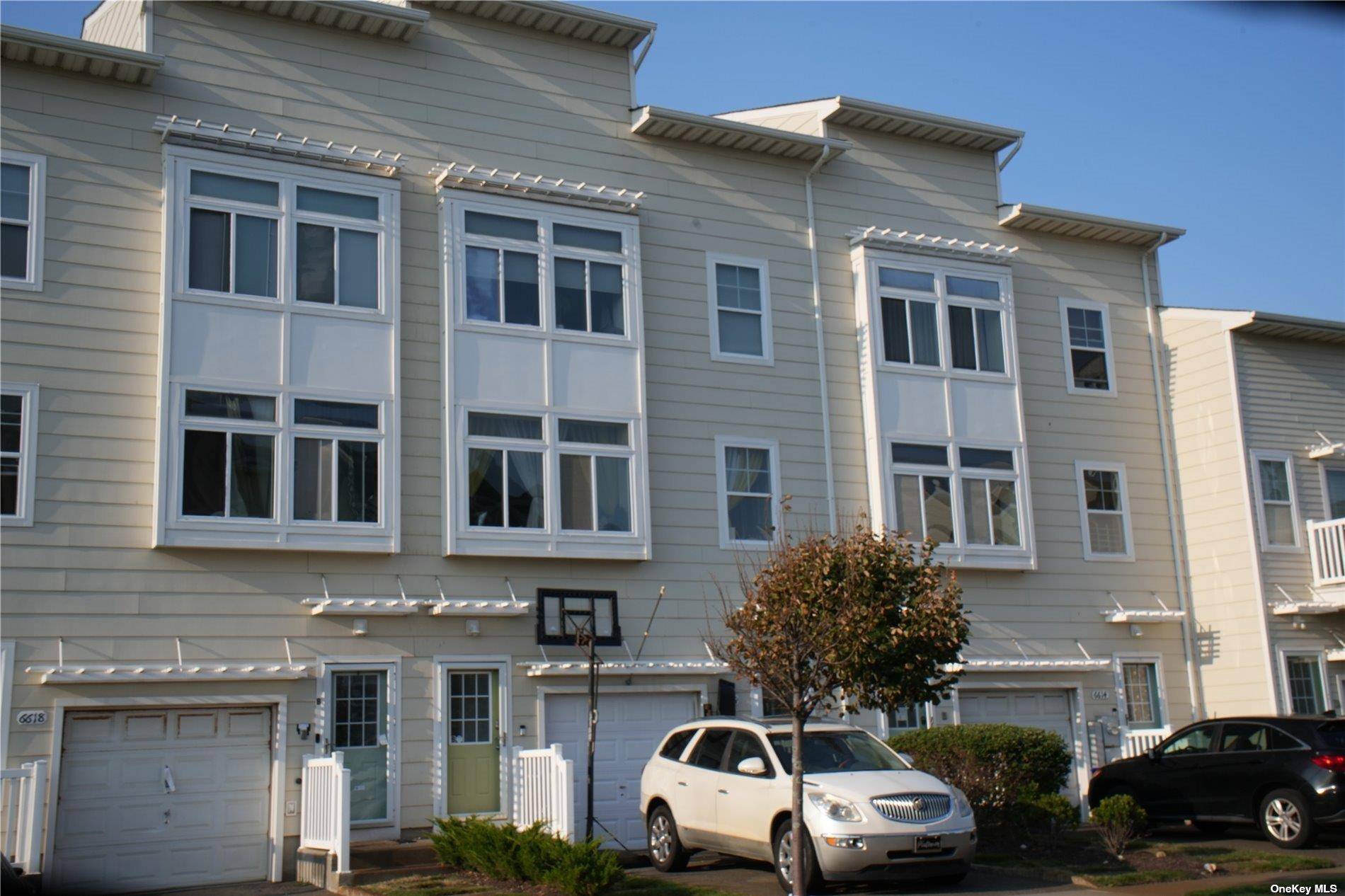 Welcome to this legal two family home in the coveted Dunes at Arverne by the Sea, where coastal charm meets modern luxury !