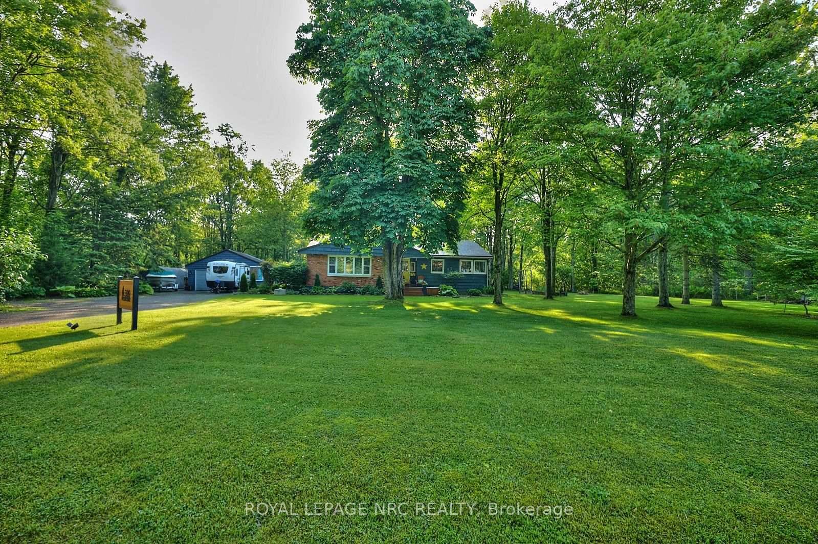 Welcome to one of the most charming and well loved properties on the street just steps from the sandy shores of Sherkston Beach !