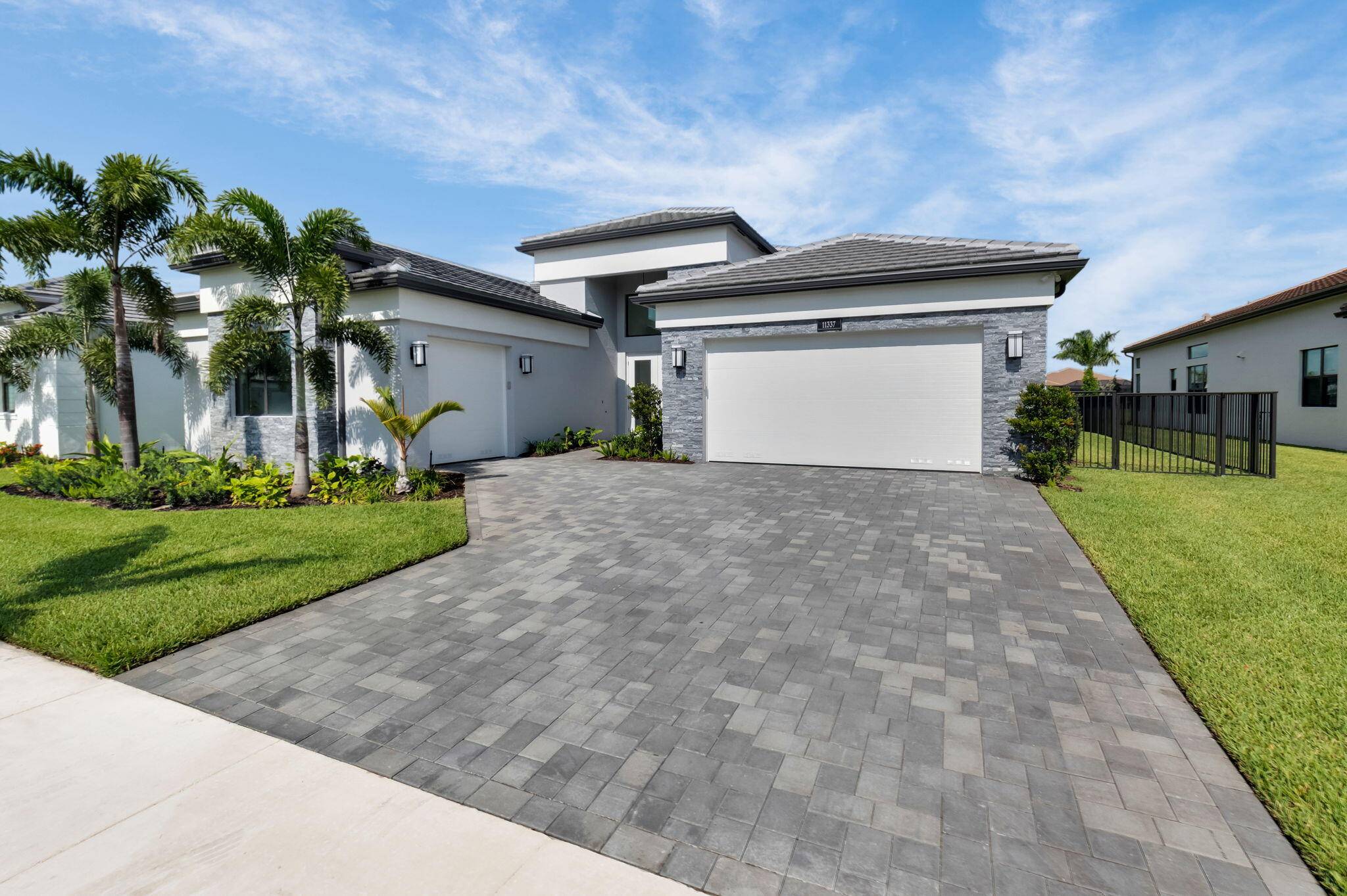 Spectacular 3 BD 4 BA POOL Home on a PREMIUM LAKE LOT in the Most Exclusive 55 GL Valencia Grand in Boynton Beach.
