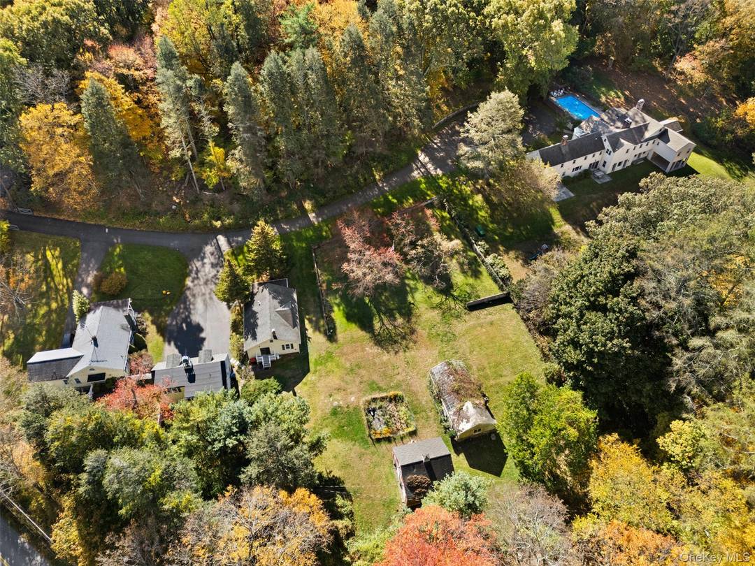 Rare Estate Compound. Surrounded by bucolic countryside, nearly seven acres in an area of foremost country homes and estates.