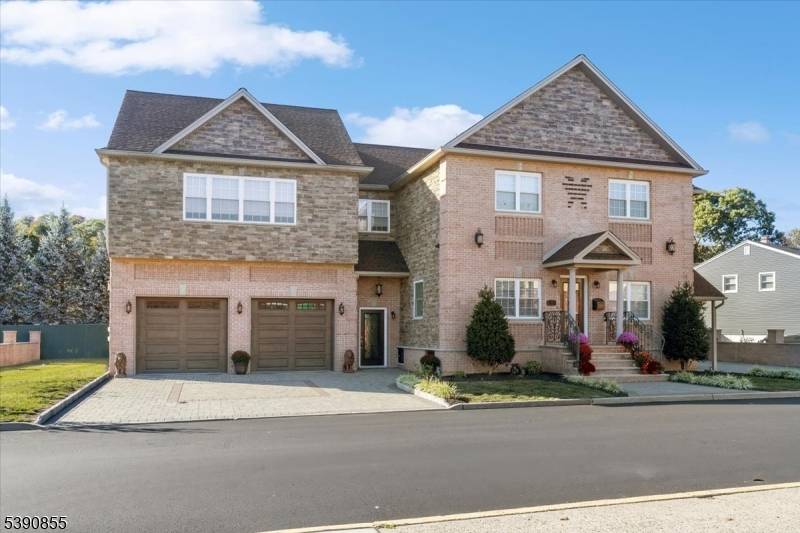 Inside, you'll find four bedrooms and four bathrooms, all featuring the modern amenities expected in a newer build wide plank hardwood flooring, multi zone heating and cooling, a heated garage, ...