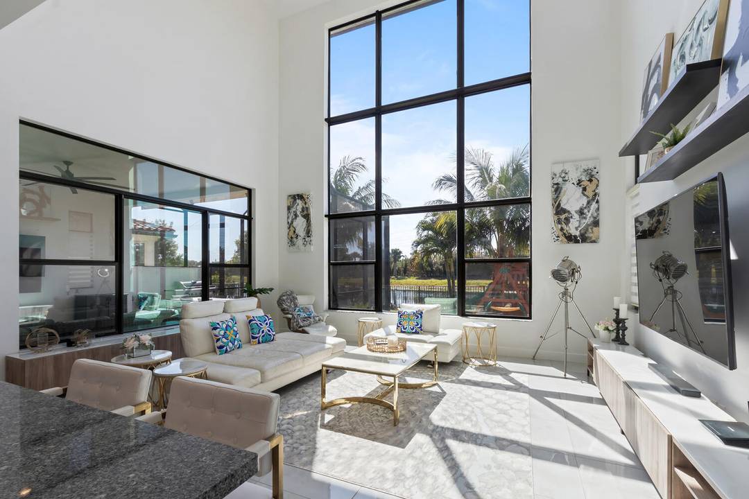 Welcome to this stunning 2 story, lakefront luxury edition home in the highly sought after and gated ''Palm Meadow Estates''.