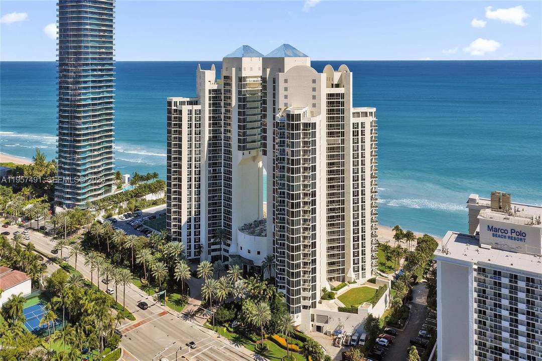Luxurious living from this 2 bed 2 1 2 bath plus den unit with stunning ocean front and intra coastal views !