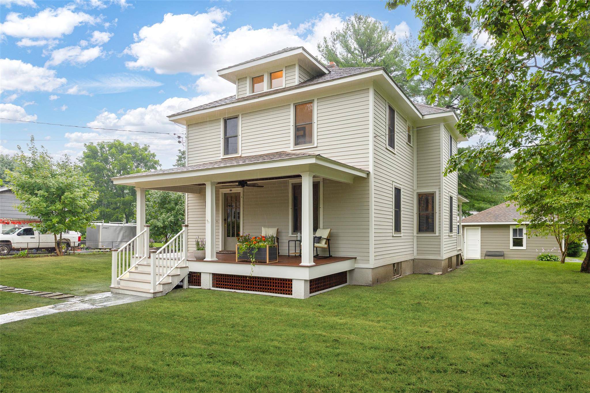 Introducing the Four Square House, a charming 1926 home restored with modern conveniences and historic appeal.