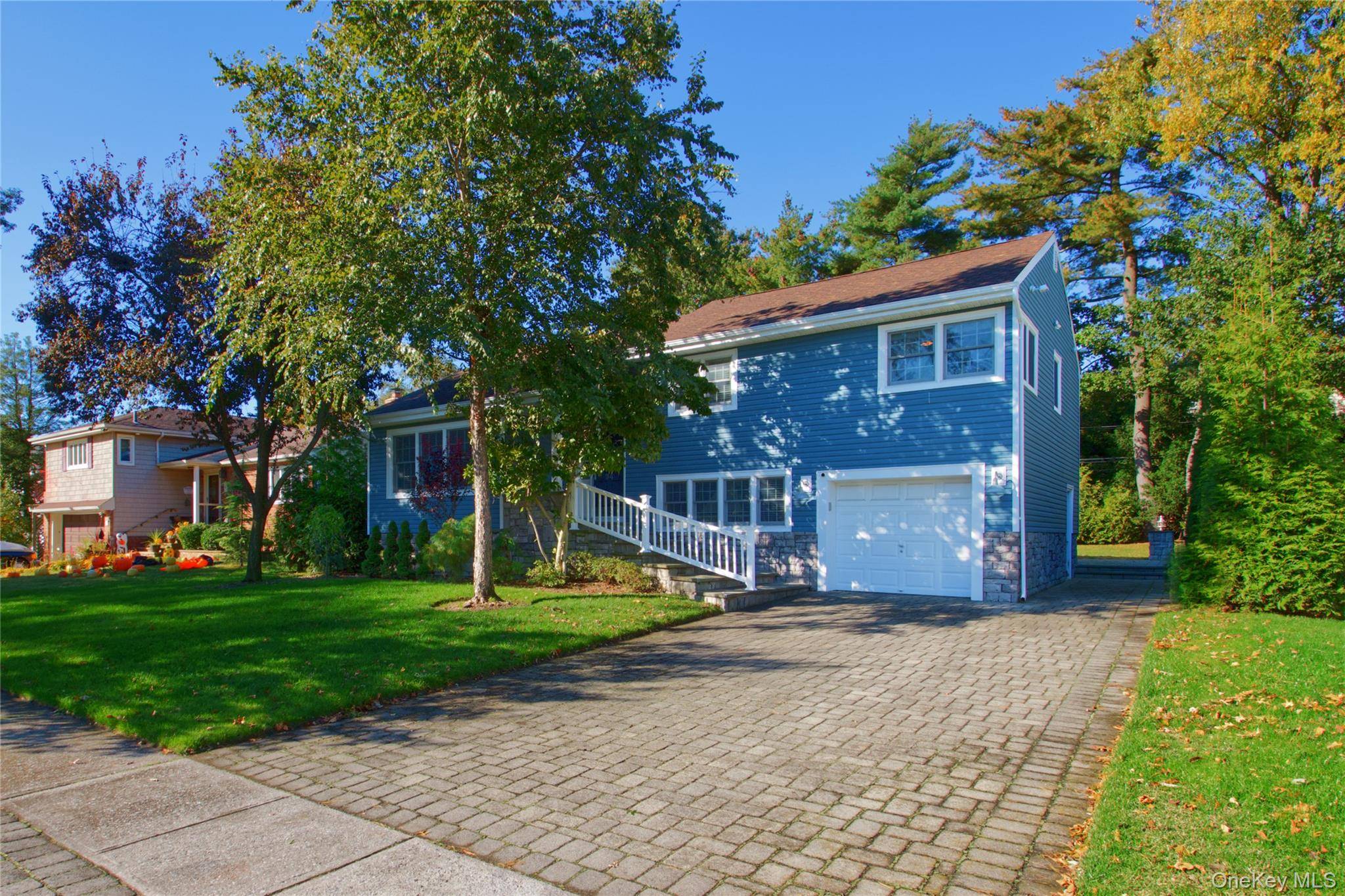 Beautifully Renovated Side Split with Smart Features and Prime Location Meticulously maintained and thoughtfully updated, this stylish side split home offers an open floor plan perfect for modern living.