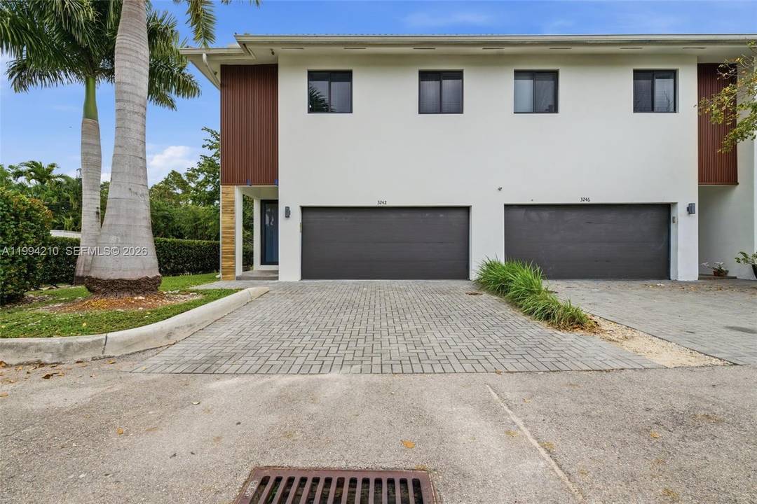Step into refined South Florida living in this 2020 impeccably designed corner unit newer construction townhome residence.