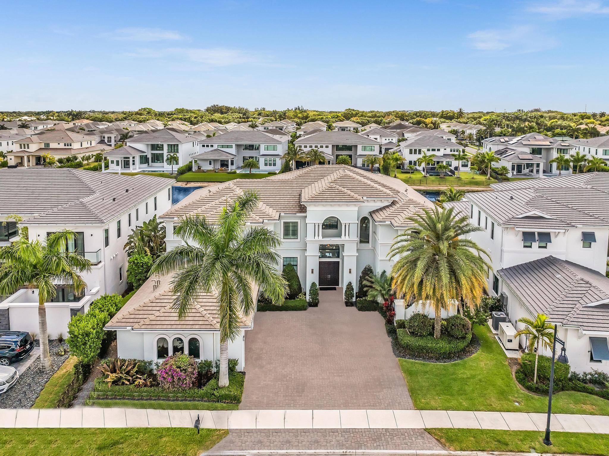Discover the pinnacle of luxury in Boca Raton's prestigious Royal Palm Polo with this exquisite Villa Lago Chateau by Spanning 7, 307 sq ft, this home features a grand two ...