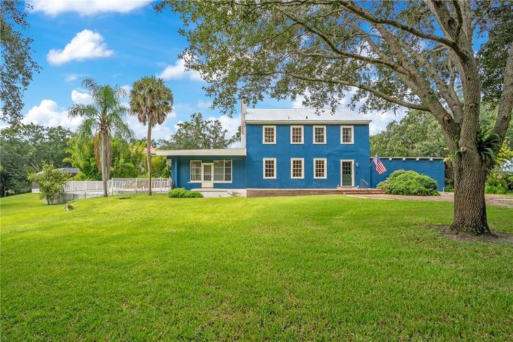At the end of a cul de sac in Gotha, this 1928 home sits on approximately one acre with mature trees, deeded lake access, and no HOA.