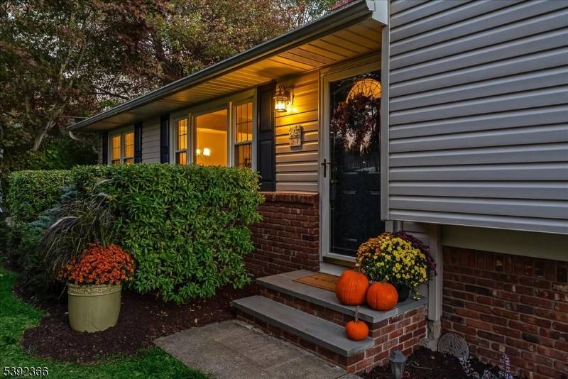 Welcome Home ! This beautiful 4 bedroom split level is nestled in the desirable Flanders section of Mt.
